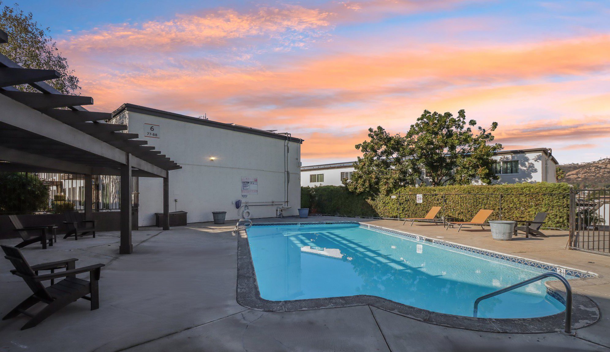 swimming pool at sunset