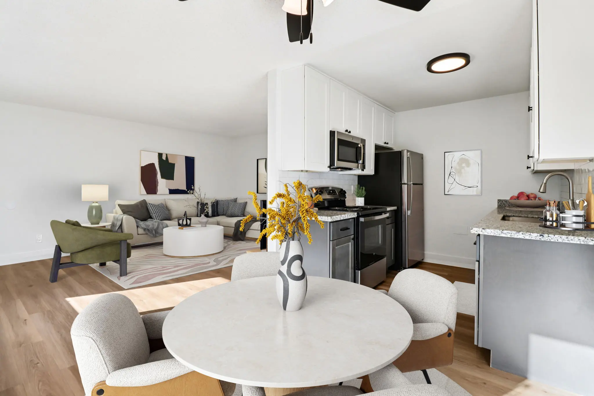 Dining area with table and chairs and view of living area and Kitchen with stainless steel appliances