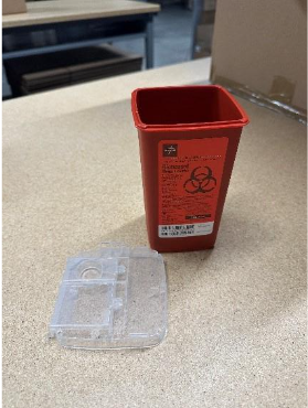 A red container with a label on a tableAI-generated content may be incorrect.