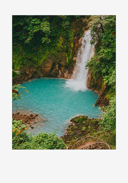 A polaroid picture of Rio Celeste waterfall from the top of the path leading down to the natural pool.