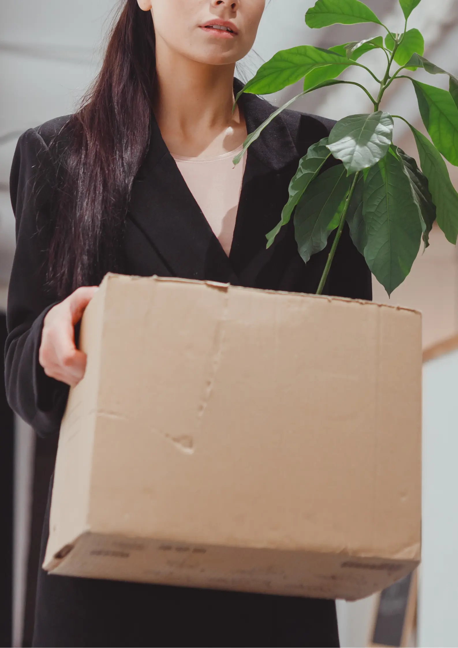 Outplacement hero image- woman holding box