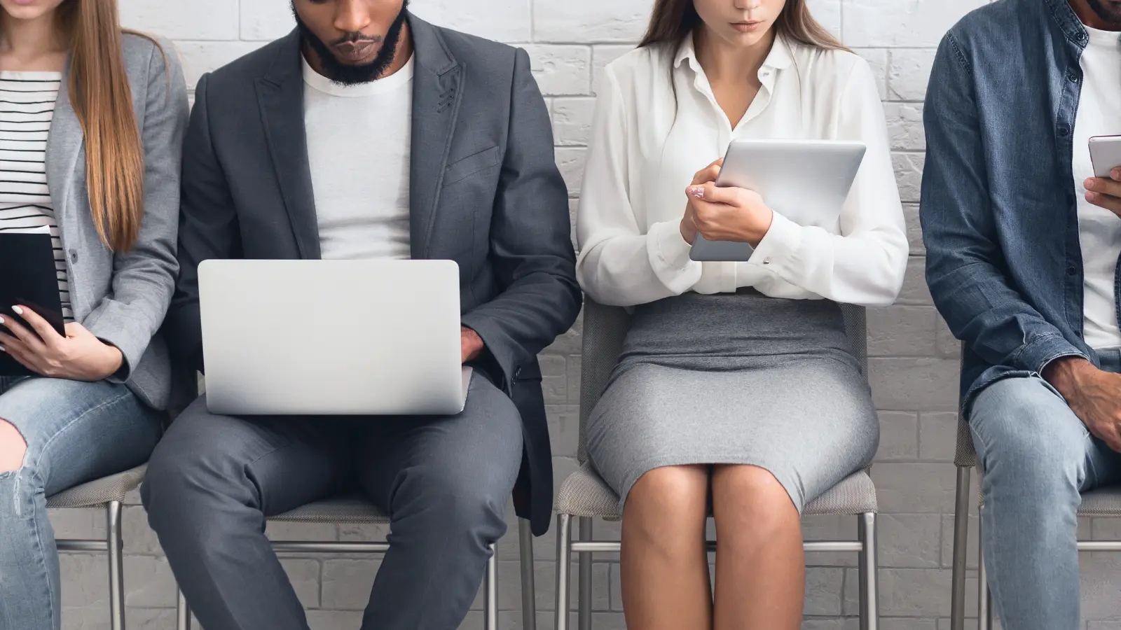 Workers at table examining company details