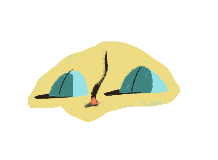 Two green camping tents set up in a sandy area with a small campfire between them.