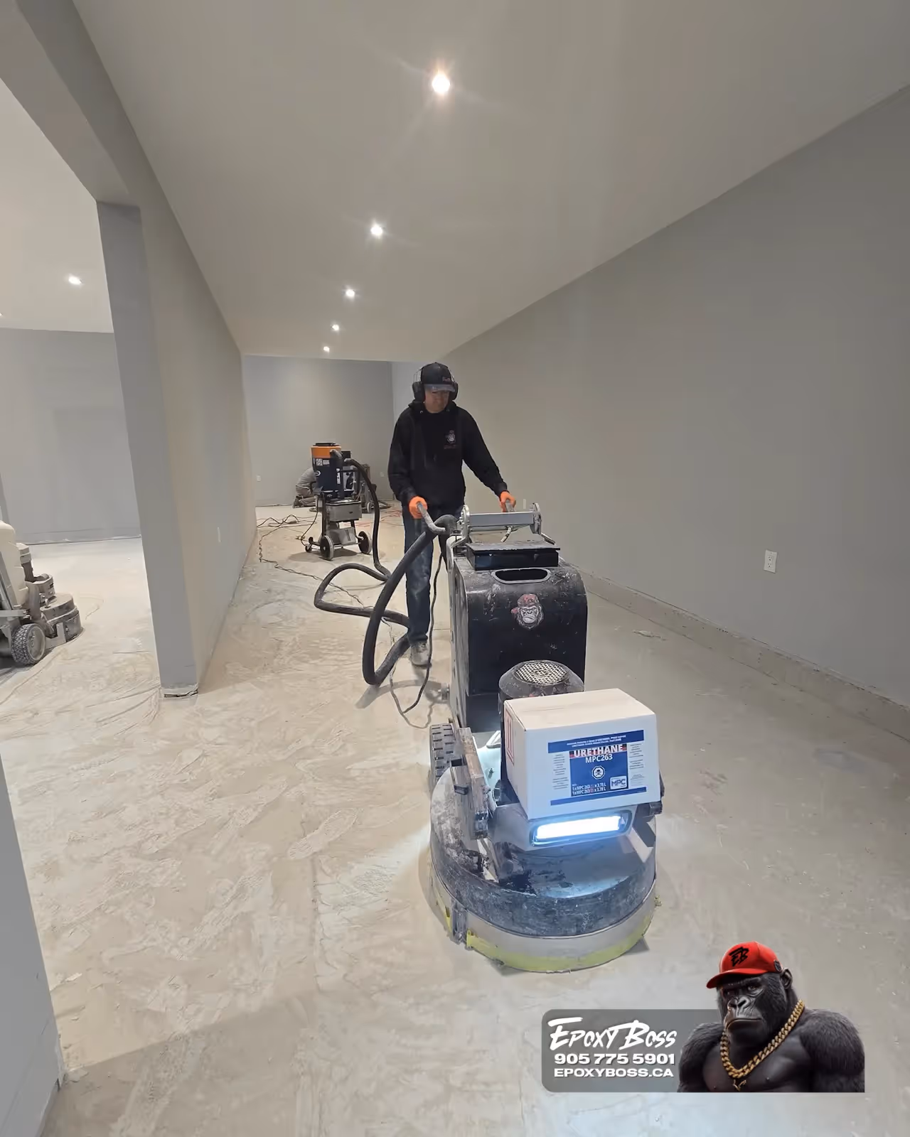 Glossy polyaspartic topcoat on epoxy floor in Burlington, Ontario