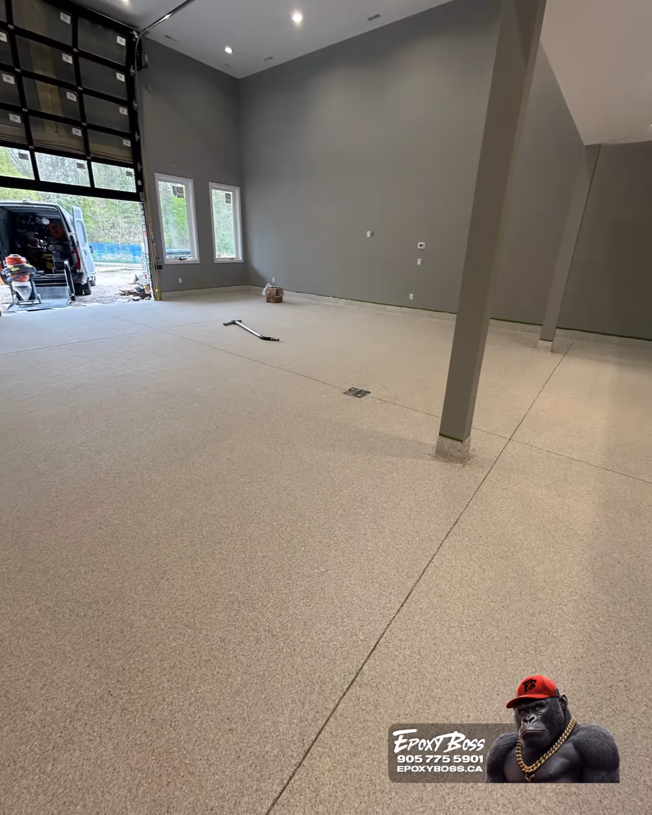 Epoxy Boss team applying full flake broadcast system in residential garage