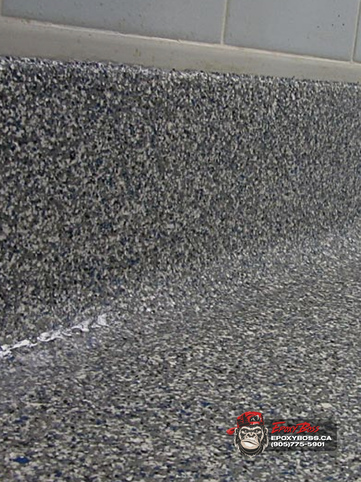 epoxy flake floor coving around column seamless base detail commercial flooring Ontario