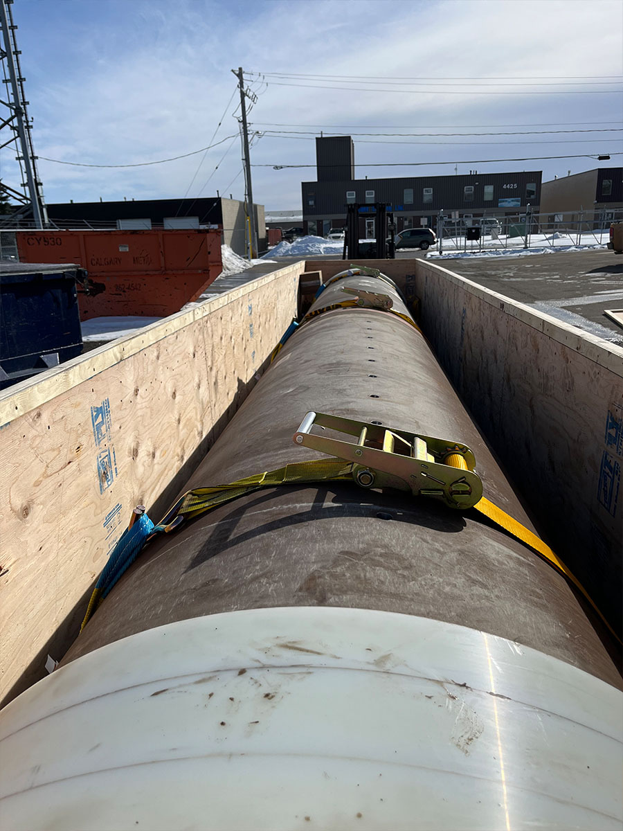 On-site field packaging team securing cargo at an industrial yard