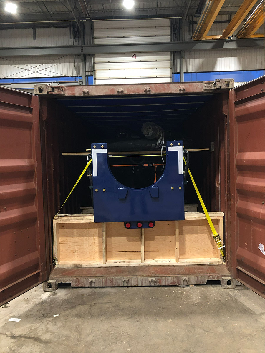 Sea container being loaded with industrial equipment at Carriers facility