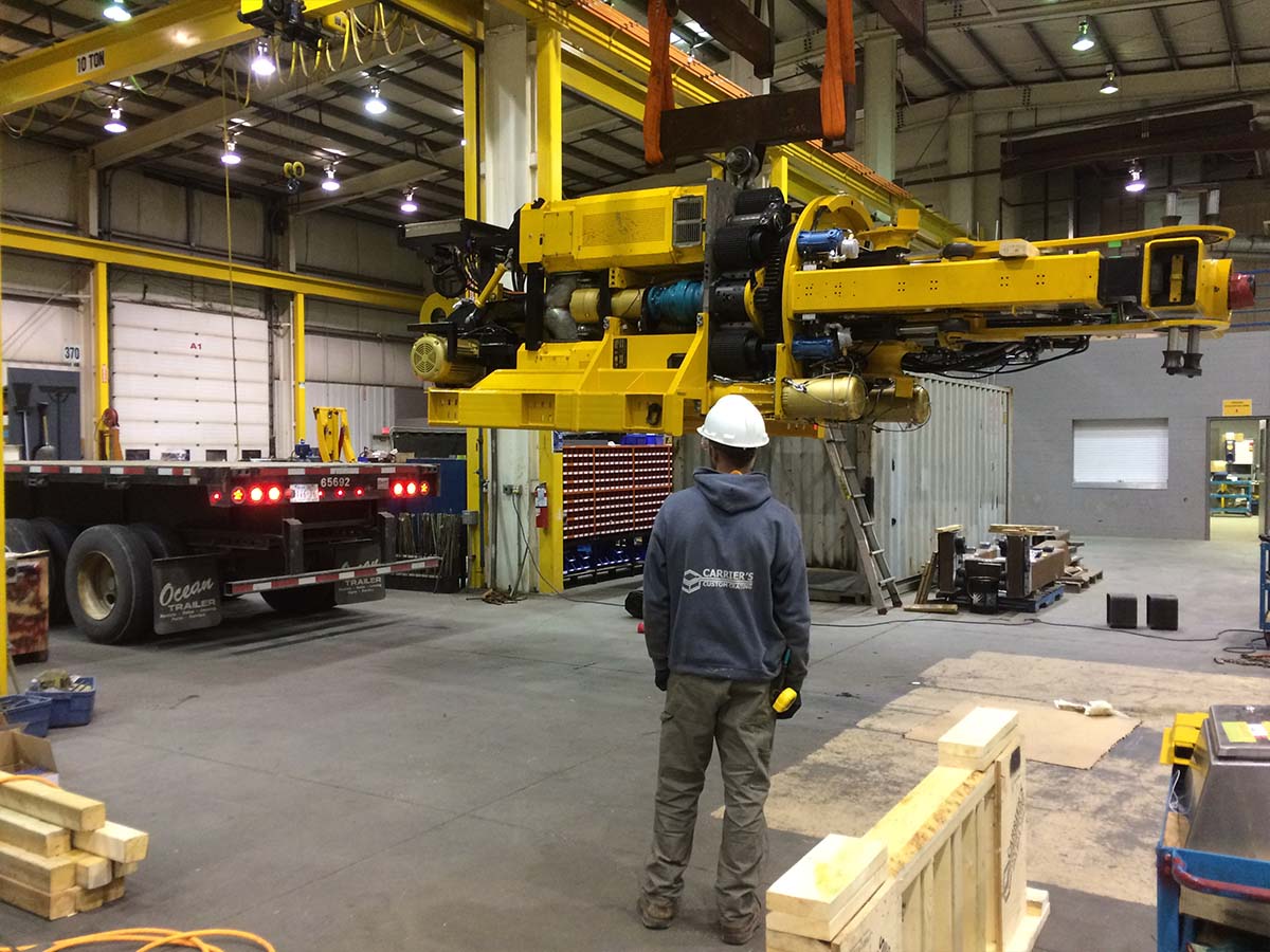 Custom equipment base skid with forklift entry pockets