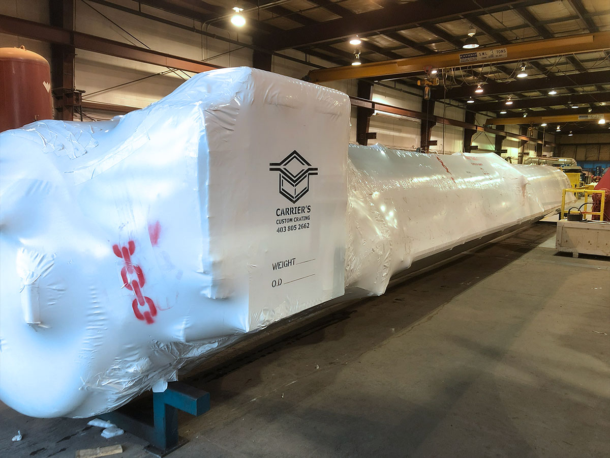 Industrial shrink wrap applied to machinery stored outdoors at a job site
