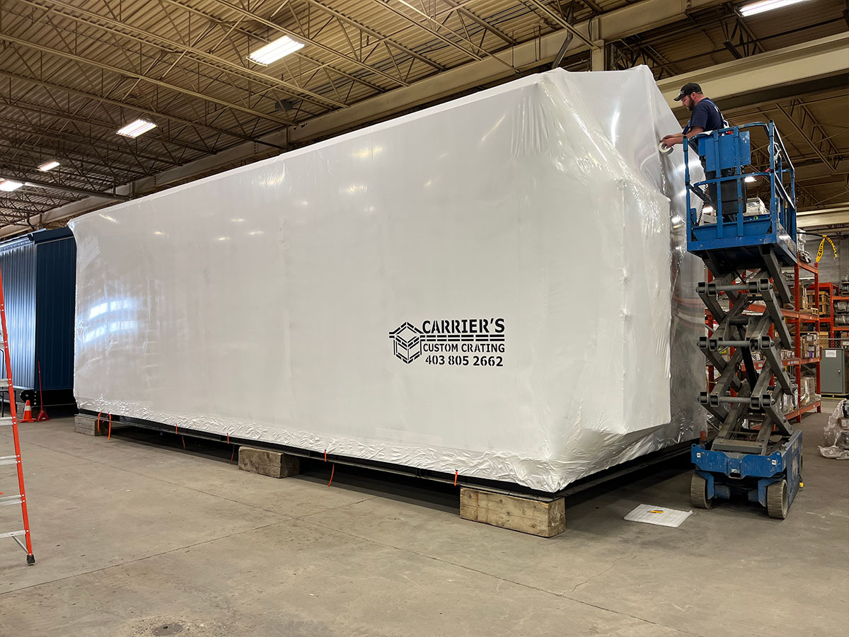 Carriers team wrapping equipment in winter conditions at an industrial facility