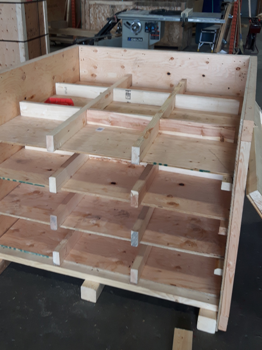 Trade show crate with anchor points and securing straps inside