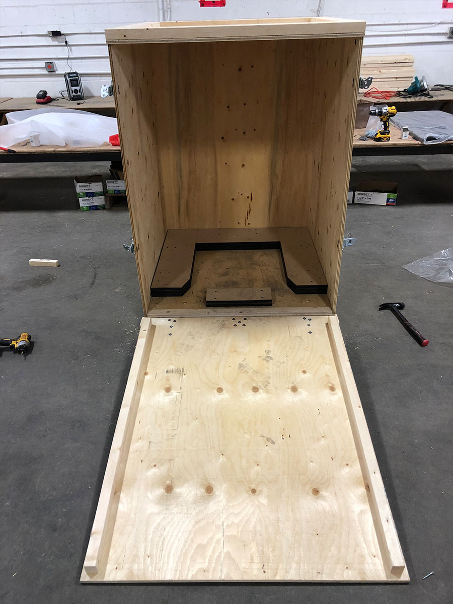 Reusable specialty crate with latched doors staged for event dispatch