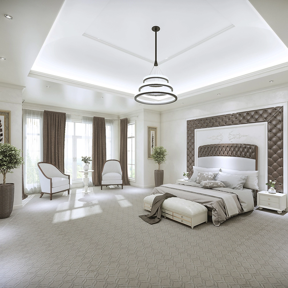 Master bedroom with beautiful patterned carpet and open floor plan. 