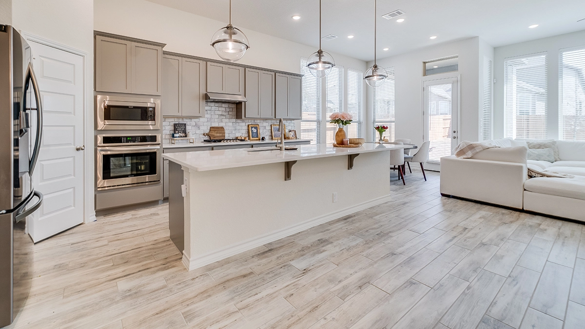 Light grey oak luxury vinyl plank flooring in modern apartment ready to rent.