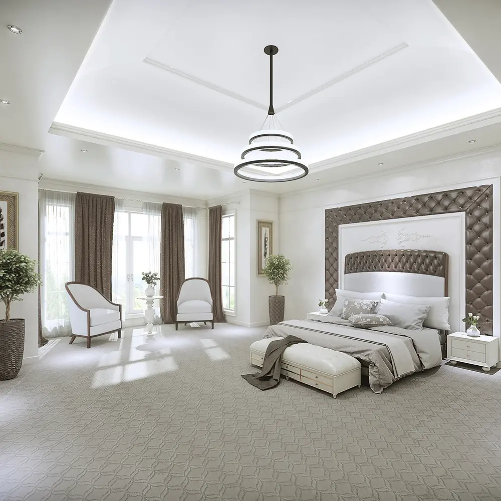 Master bedroom with beautiful patterned carpet and open floor plan. 