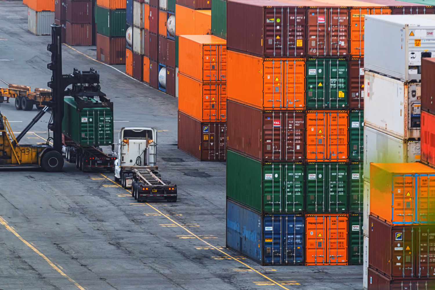Container terminal with stacked shipping containers and logistics operations.