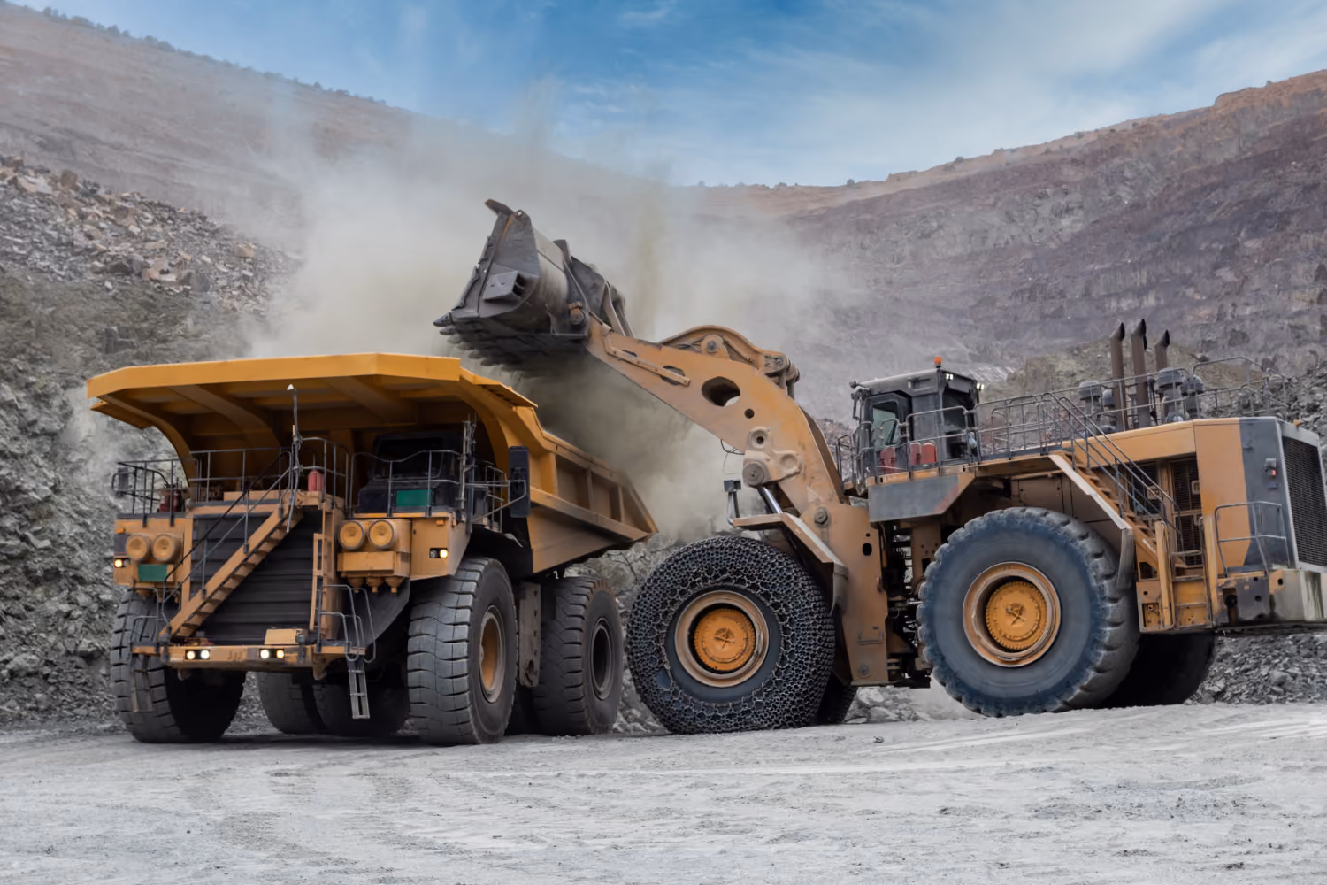 Large haul trucks operating in an open-cut mining environment.