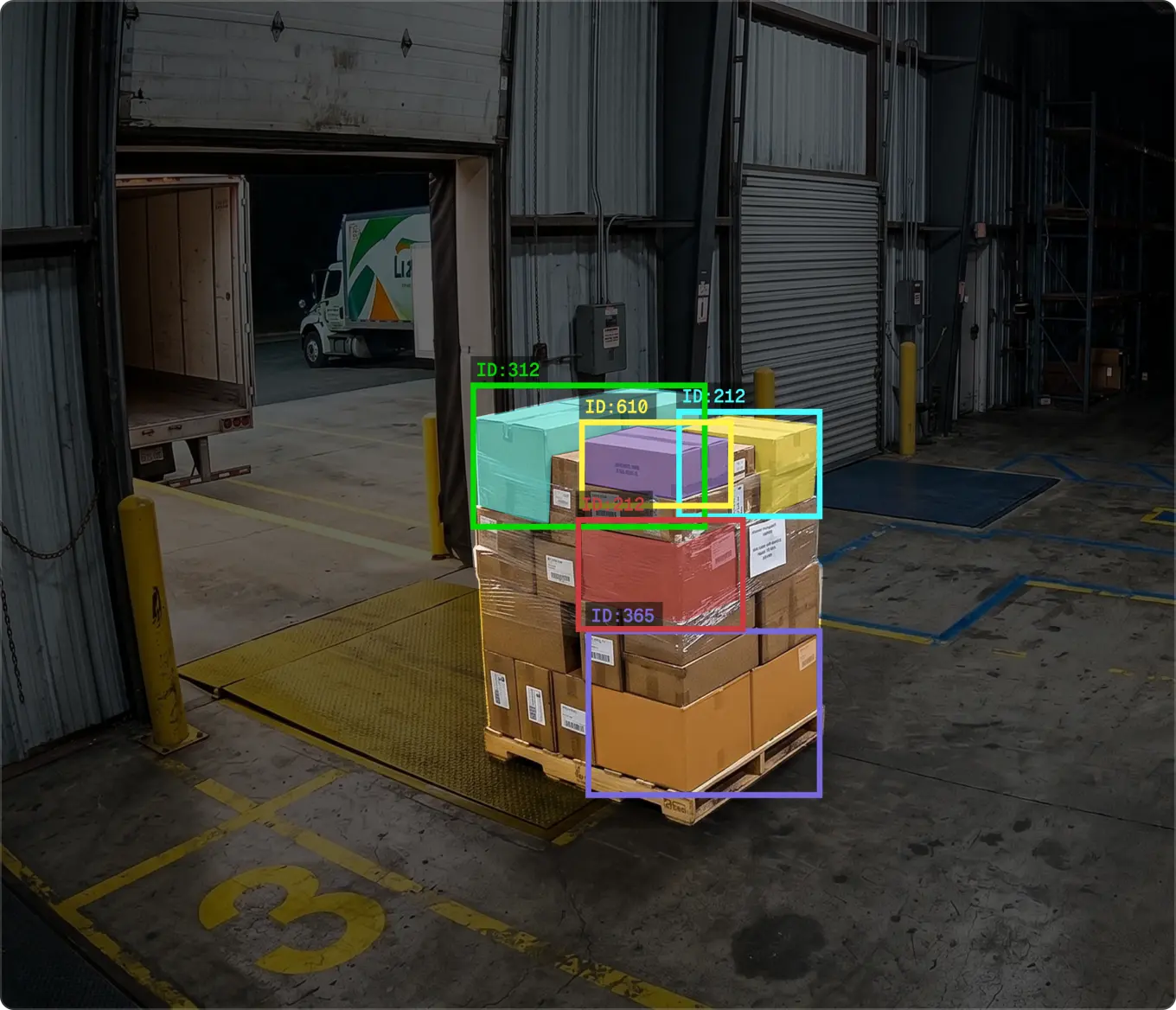 Overhead warehouse camera view of a toppled blue drum leaking a large pool of blue liquid onto the concrete floor, highlighted by a yellow detection box labeled HF 22 to illustrate environmental spill monitoring.