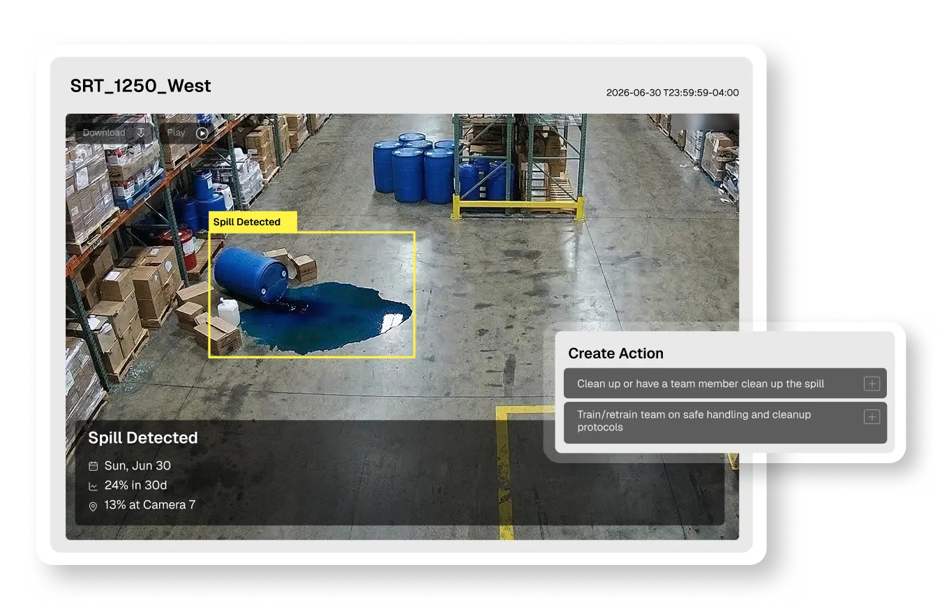 Overhead warehouse camera view of a toppled blue drum leaking a large pool of blue liquid onto the concrete floor, highlighted by a yellow detection box labeled HF 22 to illustrate environmental spill monitoring.