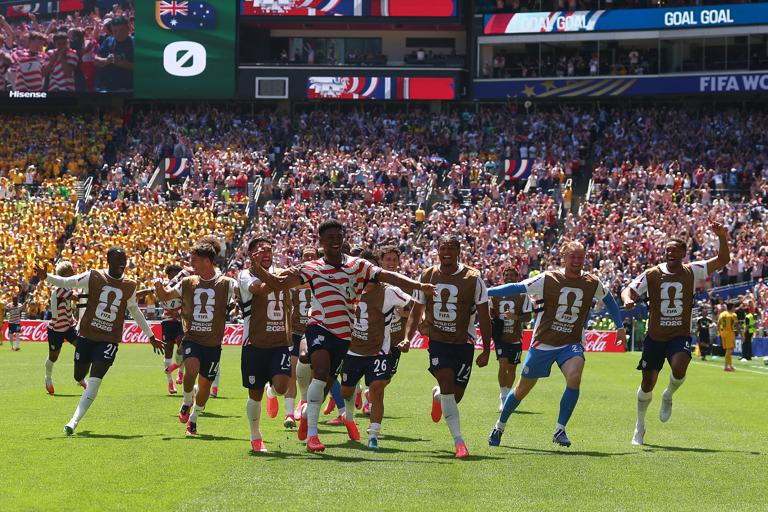 SEATTLE, WASHINGTON - JUNE 19:  Alex Freeman of USA celebrates scoring a goal to make the score 2-0 with his team-mates during the FIFA World Cup 2026 Group D match between USA and Australia at Seattle Stadium on June 19, 2026 in Seattle, United States. (Photo by Chris Brunskill/Fantasista/Getty Images)