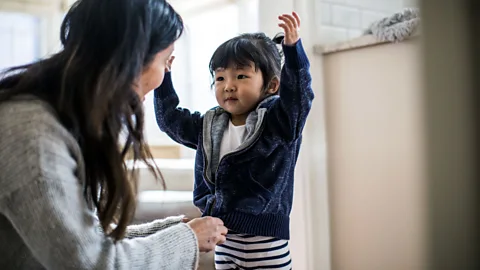 Getty Images Mothers doing tasks like picking a child's outfits are examples of "maternal gatekeeping" – subtle tasks that fall to mums to take the lead on (Credit: Getty Images)