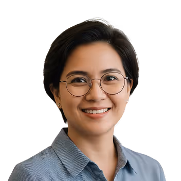 Smiling woman with short dark hair wearing round glasses and a light blue collared shirt.
