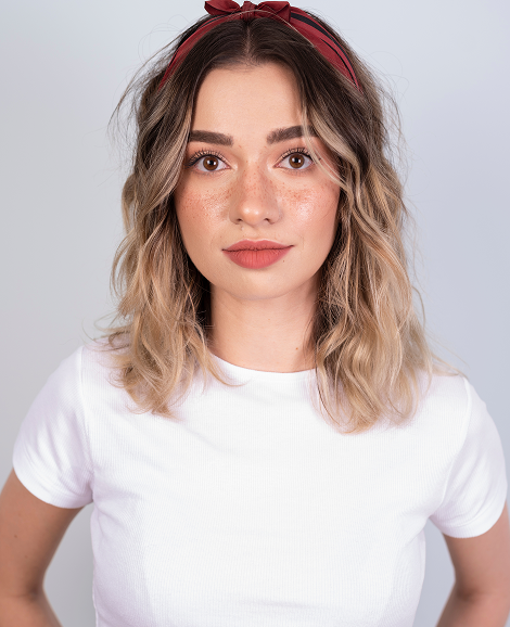 Team member portrait (Sophie Keller): Professional woman portrait against neutral background.