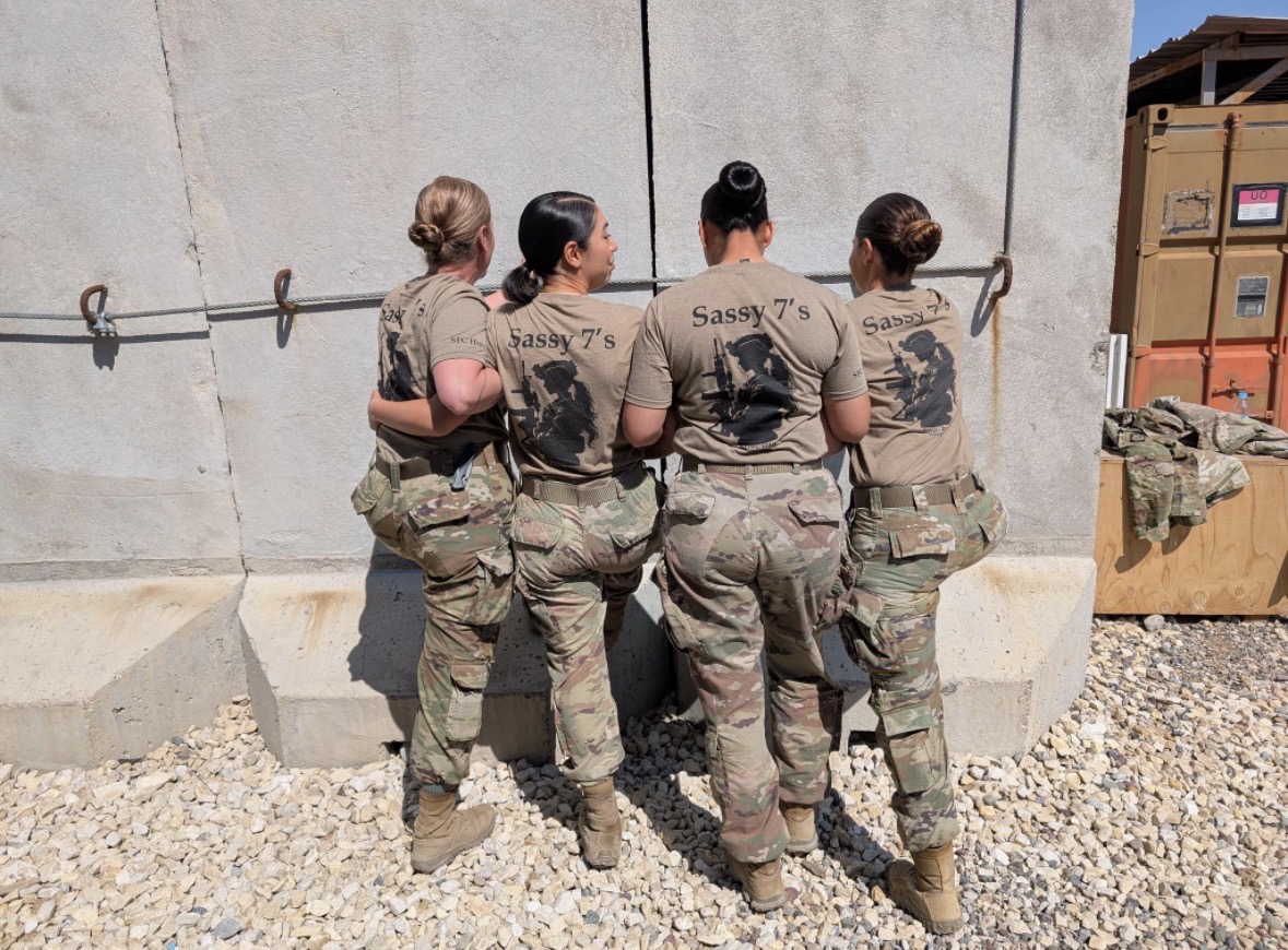 Four Army Soldiers in Iraq wearing "Sassy 7's" shirts