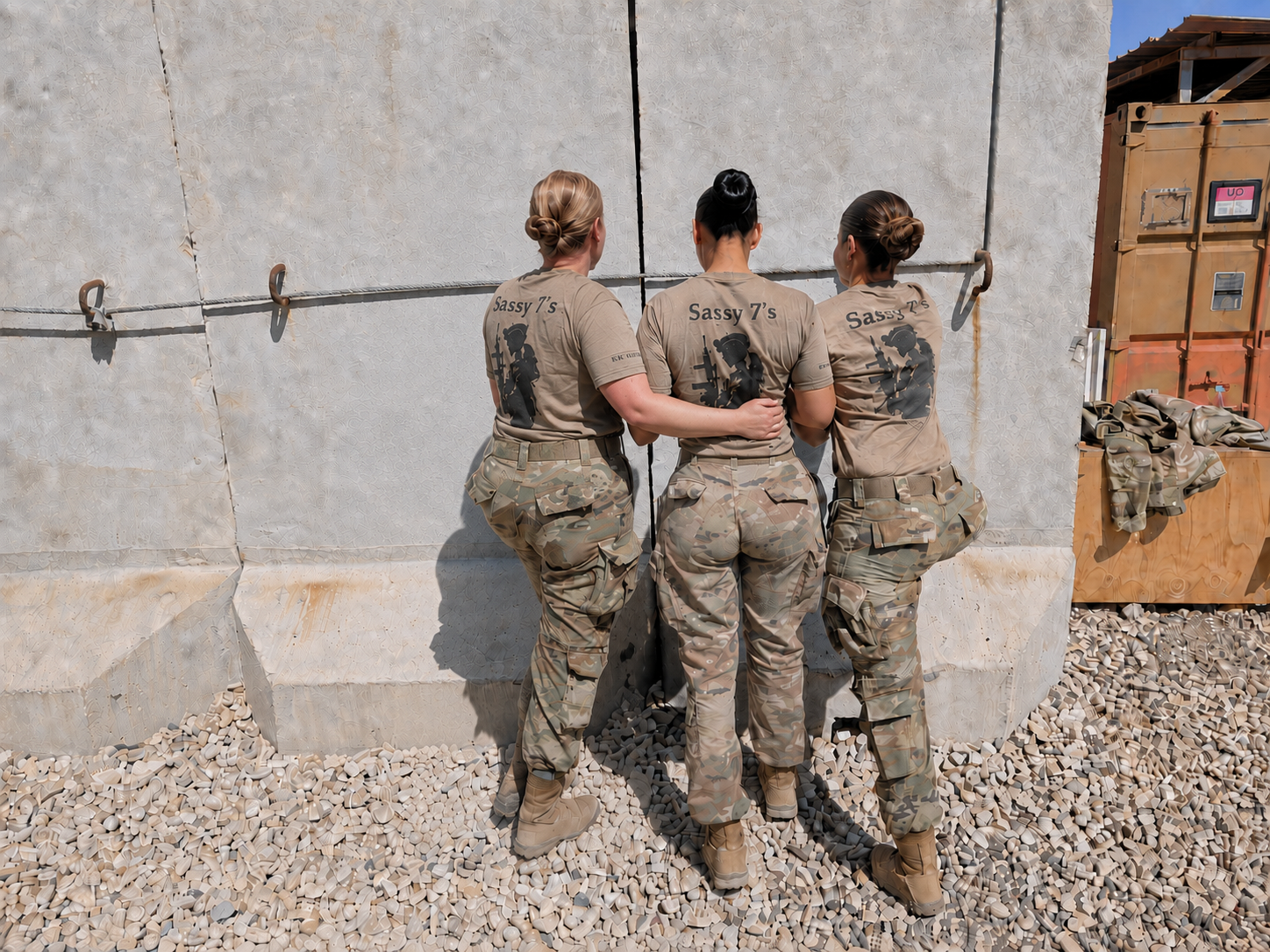 Three female Soldiers facing away.