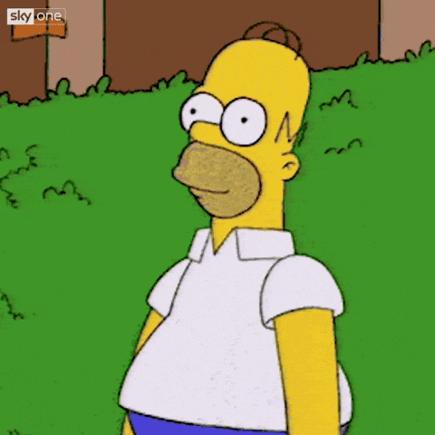 Homer Simpson slowly backing into a hedge until he disappears