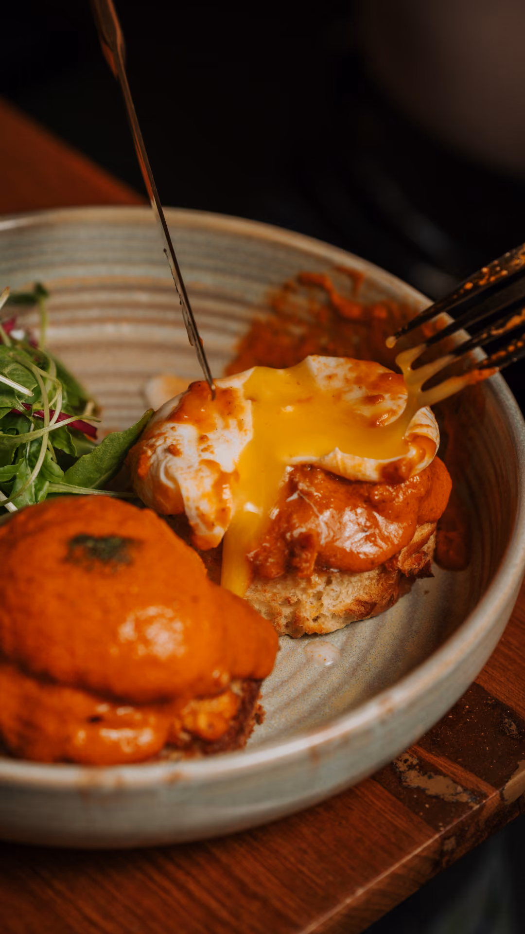 Fork lifting a bite from an Indian brunch dish