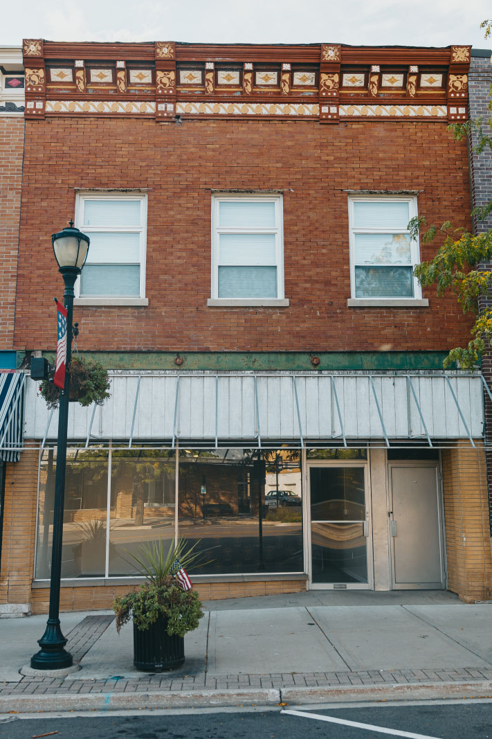 Two-story brick facade of the Northwest Rescue Harvard station in Harvard, Illinois