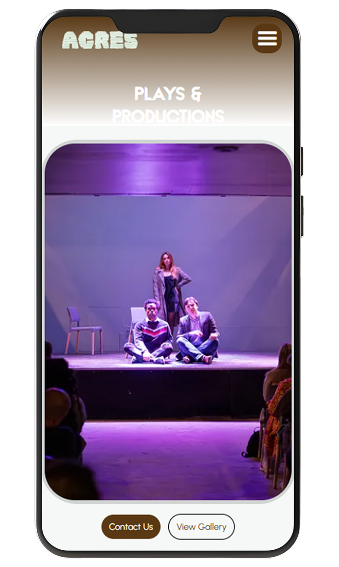 Mobile screen showing a theater stage with two men sitting cross-legged and a woman standing behind them under purple lighting.