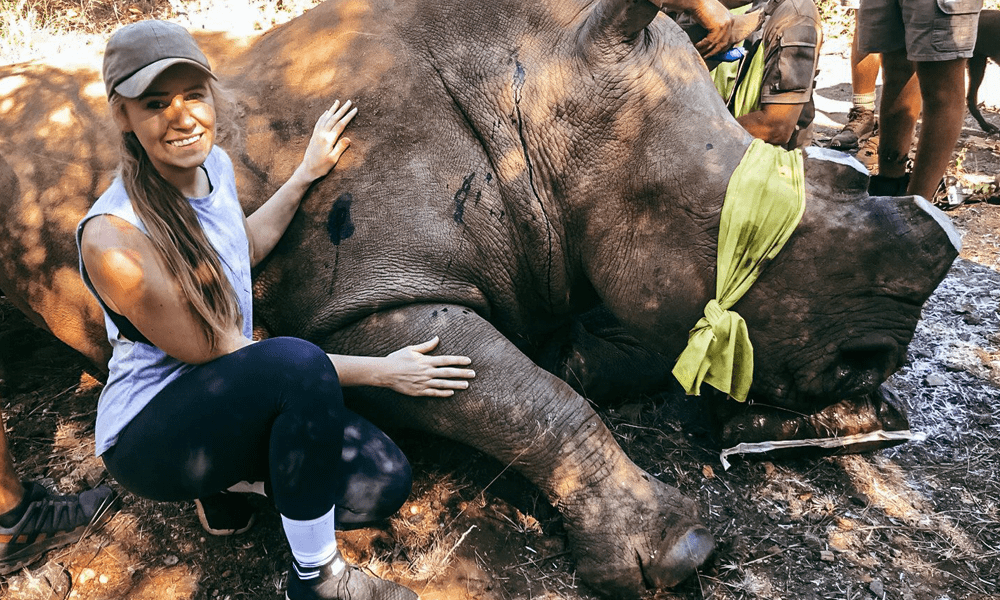 Kayleigh de Villiers with a rhino