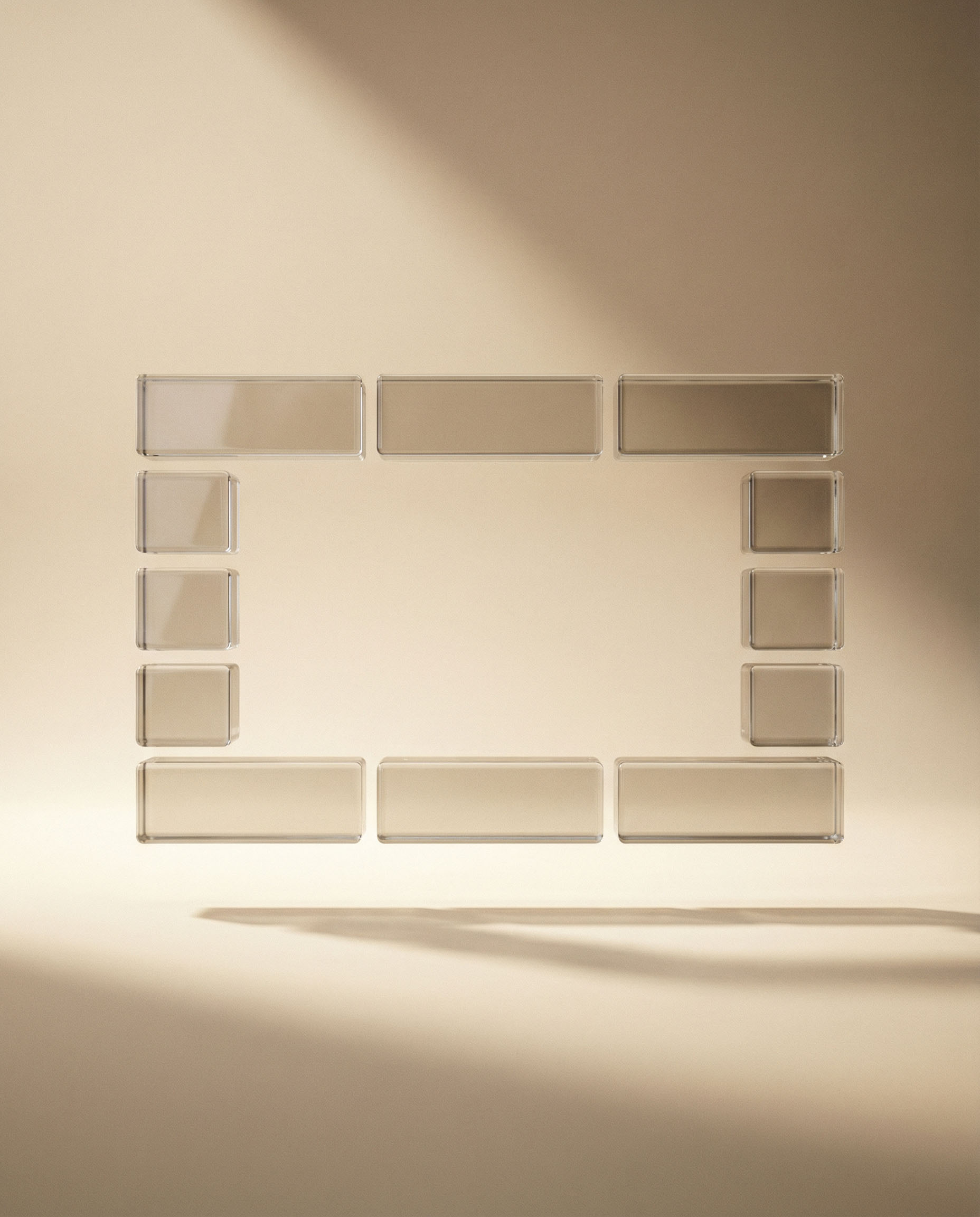 Translucent rectangular and square blocks arranged in a rectangular frame on a beige background with soft shadows.