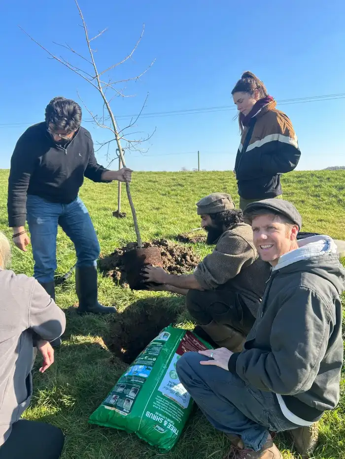 Community volunteer group participating in a tree-planting initiative.