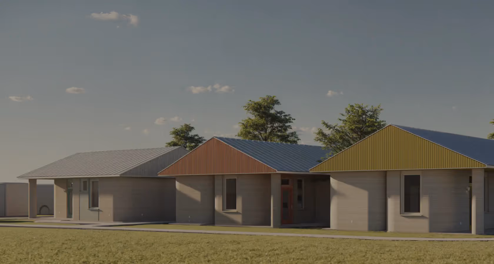 Row of three single-story modern homes with colored metal roofs and trees