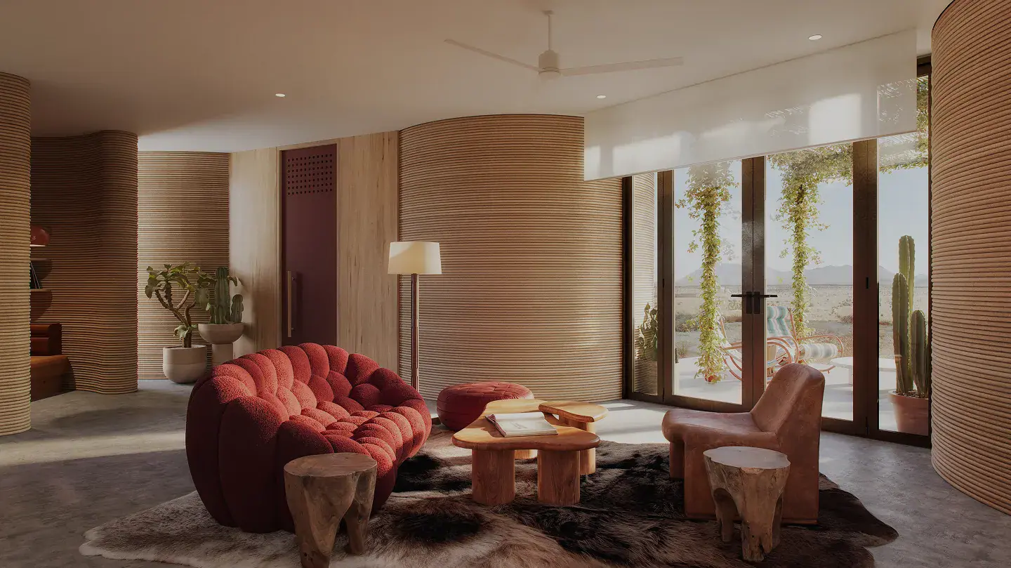 Living room with red sofa, wooden coffee tables, leather chair, ribbed curved walls and glass doors