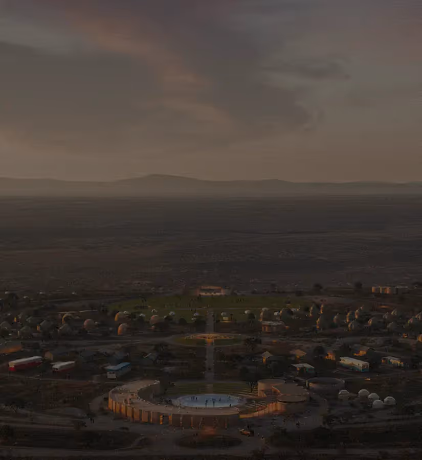 Aerial view of circular plaza and cluster of dome buildings under a dusky sky