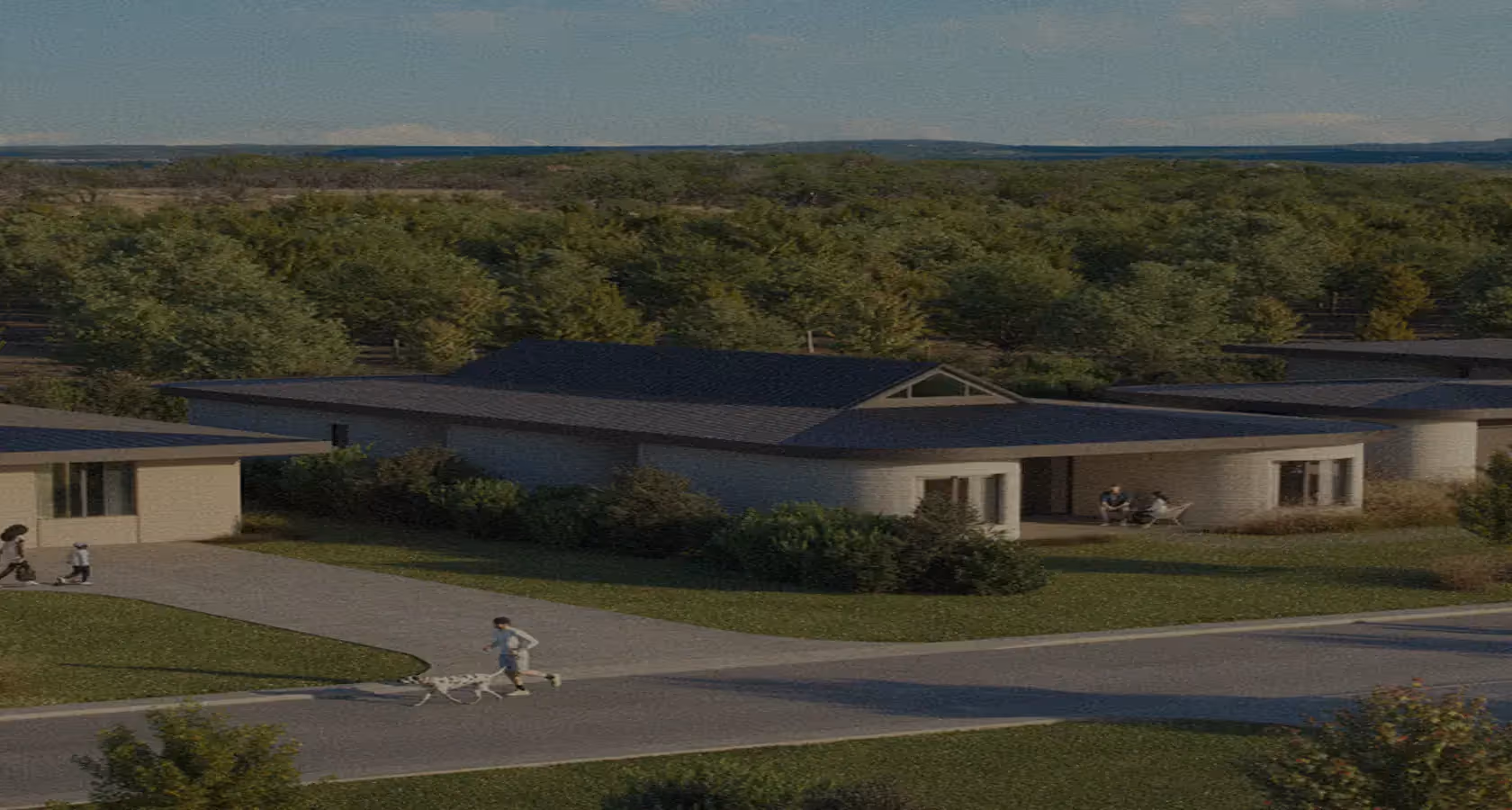 Single-story modern homes with low roofs, surrounding trees, a jogger walking a dog on the road