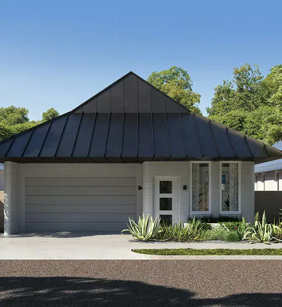 Single-story modern home with dark metal roof and two-car garage
