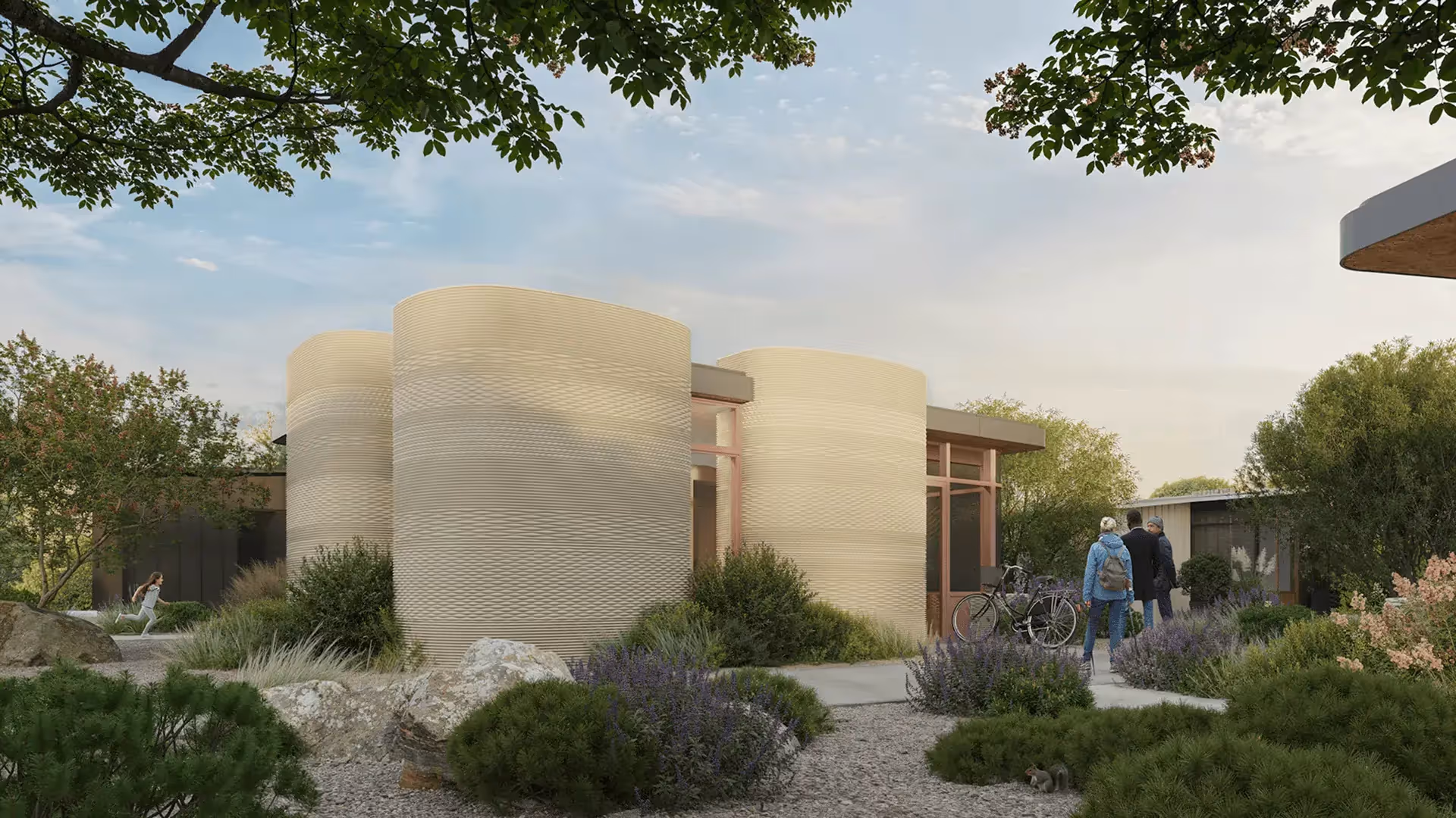 3D-printed cylindrical home exterior with landscaping and people at entrance