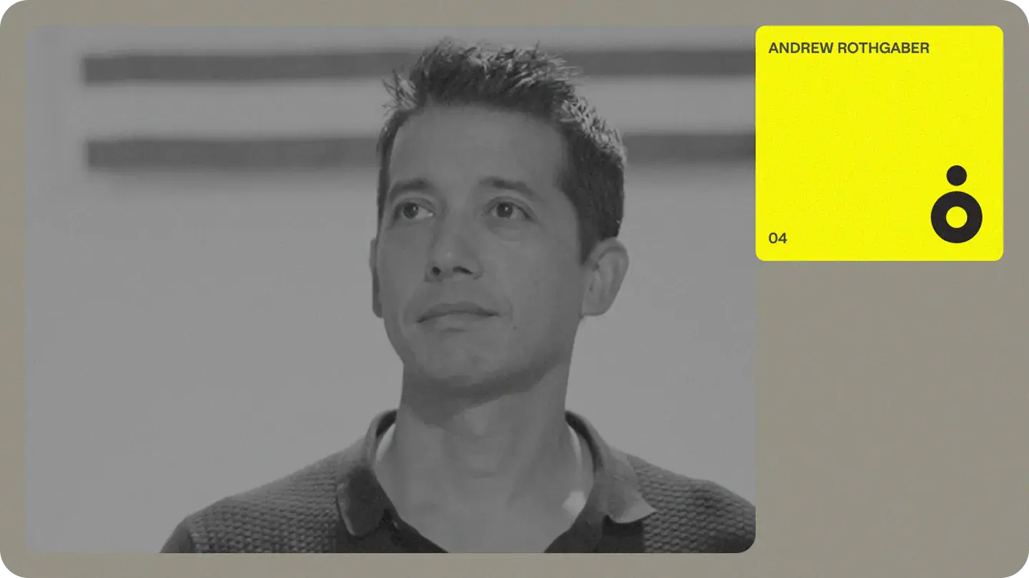 Black-and-white portrait of a man gazing upward, accompanied by a bright yellow name card marking a team profile.