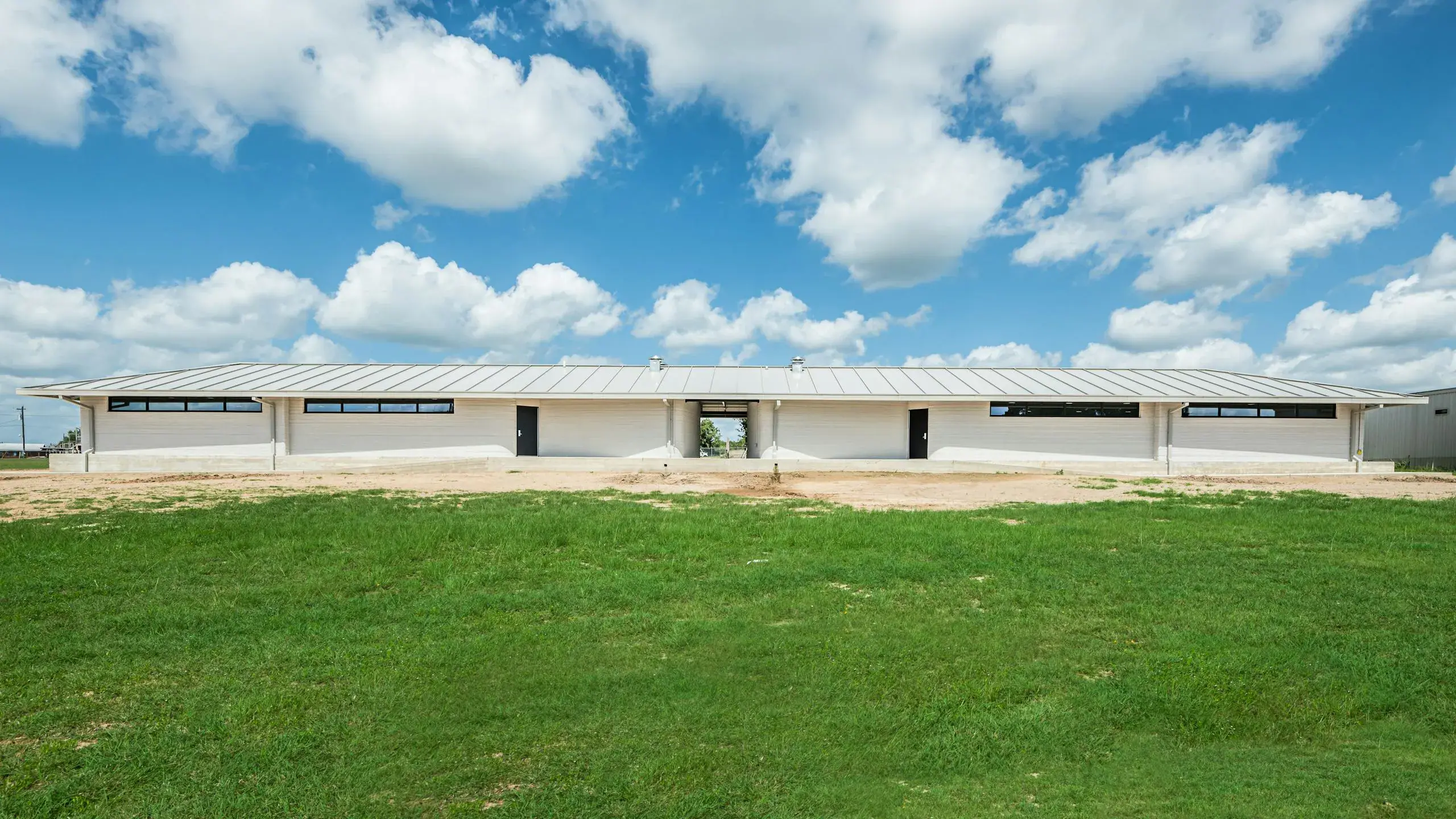 ICON 3 D printed Barracks Designed by Logan Architecture Camp Swift Texas 2021 