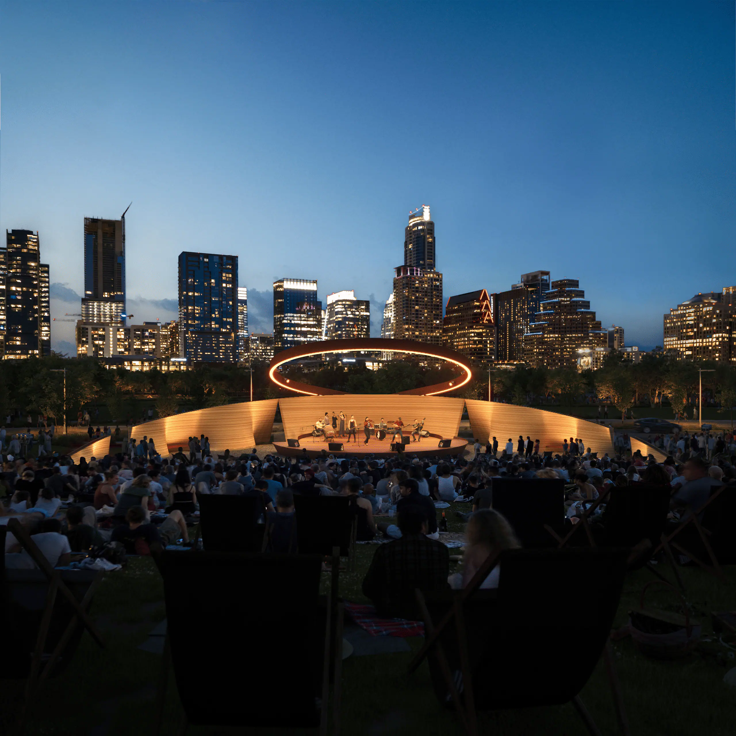 Wooden ring-lit outdoor pavilion with band and large audience against a lit modern city skyline at dusk