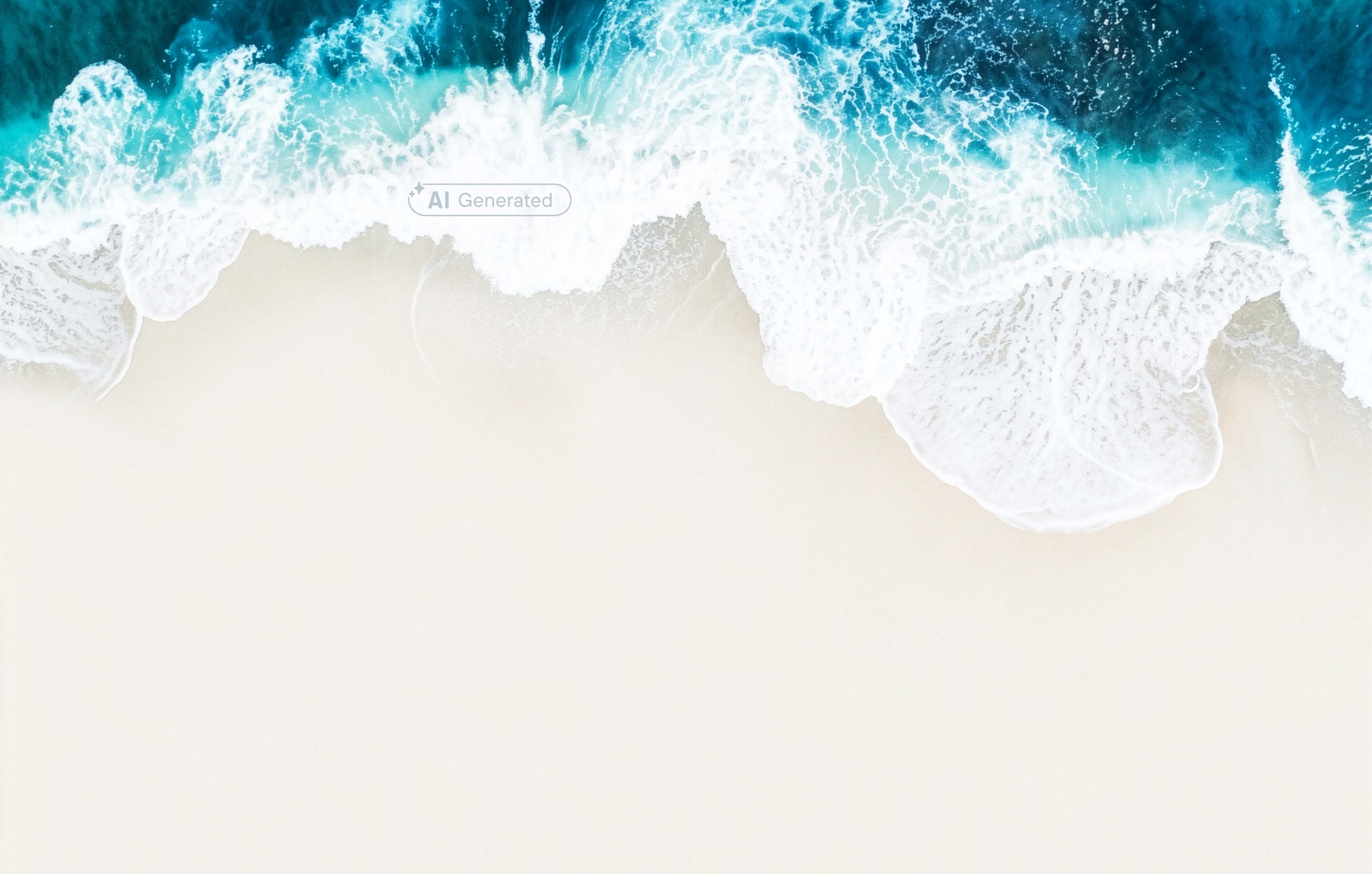Aerial view of ocean waves crashing onto a sandy beach.