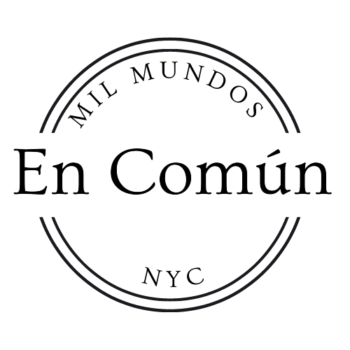 Circular logo of En Común NYC with serif wordmark centered inside a thin round border