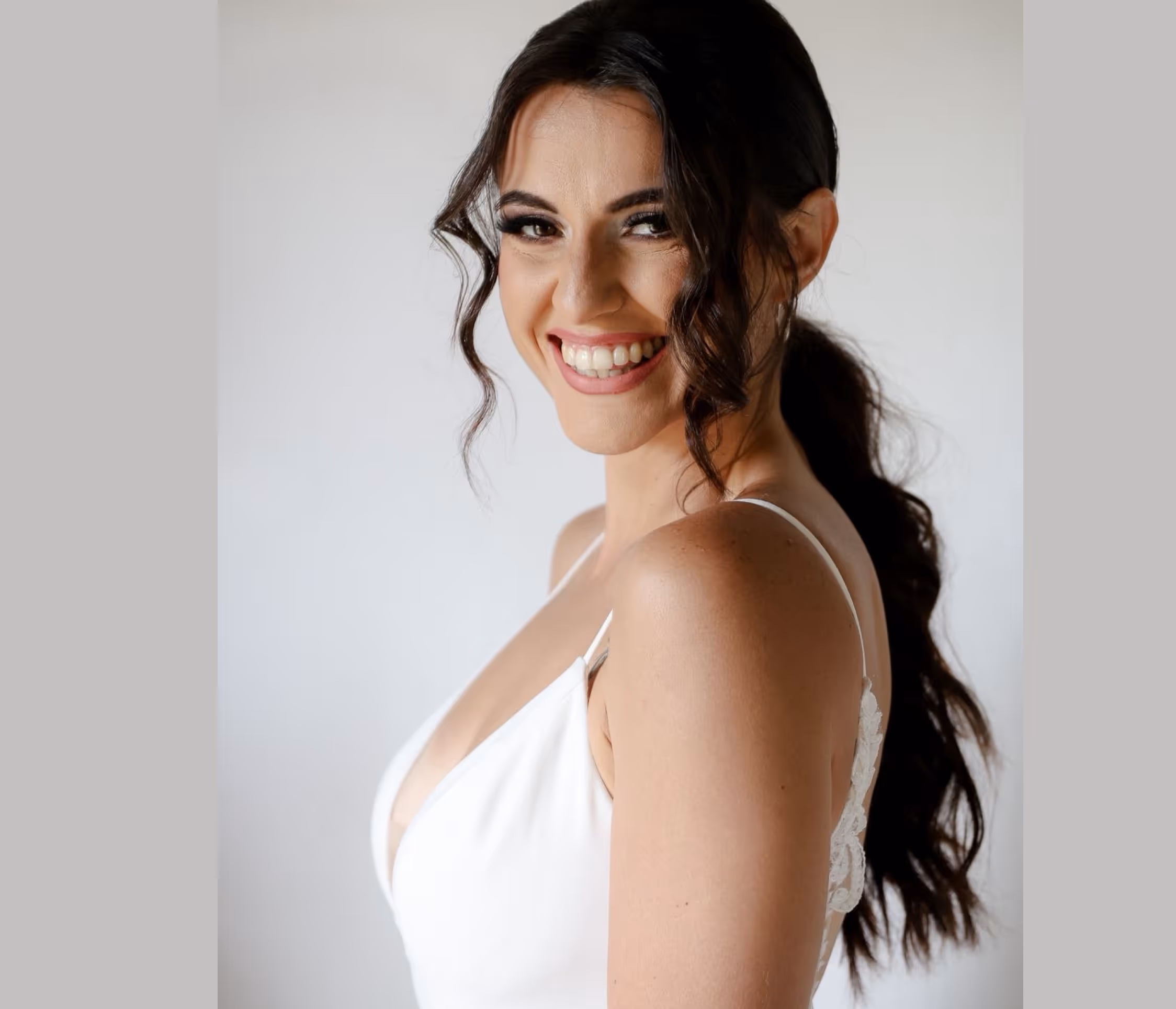 Portrait of Carmen Meyer, co-founder of Meyer Digital Co., smiling against a light background