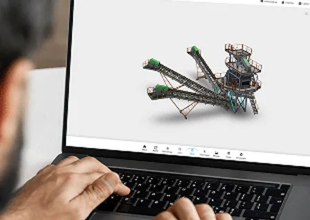 Personne visualisant un modèle 3D d’un équipement industriel sur l’écran d’un ordinateur portable.
